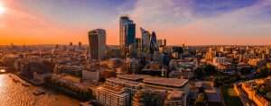 Breathtaking scenery of sunrise over high skyscrapers and modern buildings in London, UK