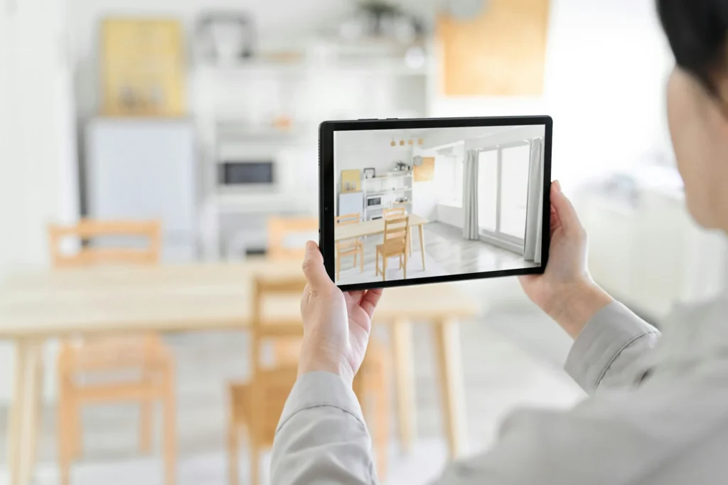 A woman using an AR app to simulate furniture placement