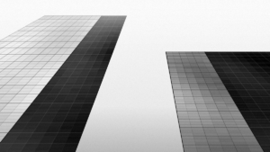 Office towers seen from street level, black and white illustration