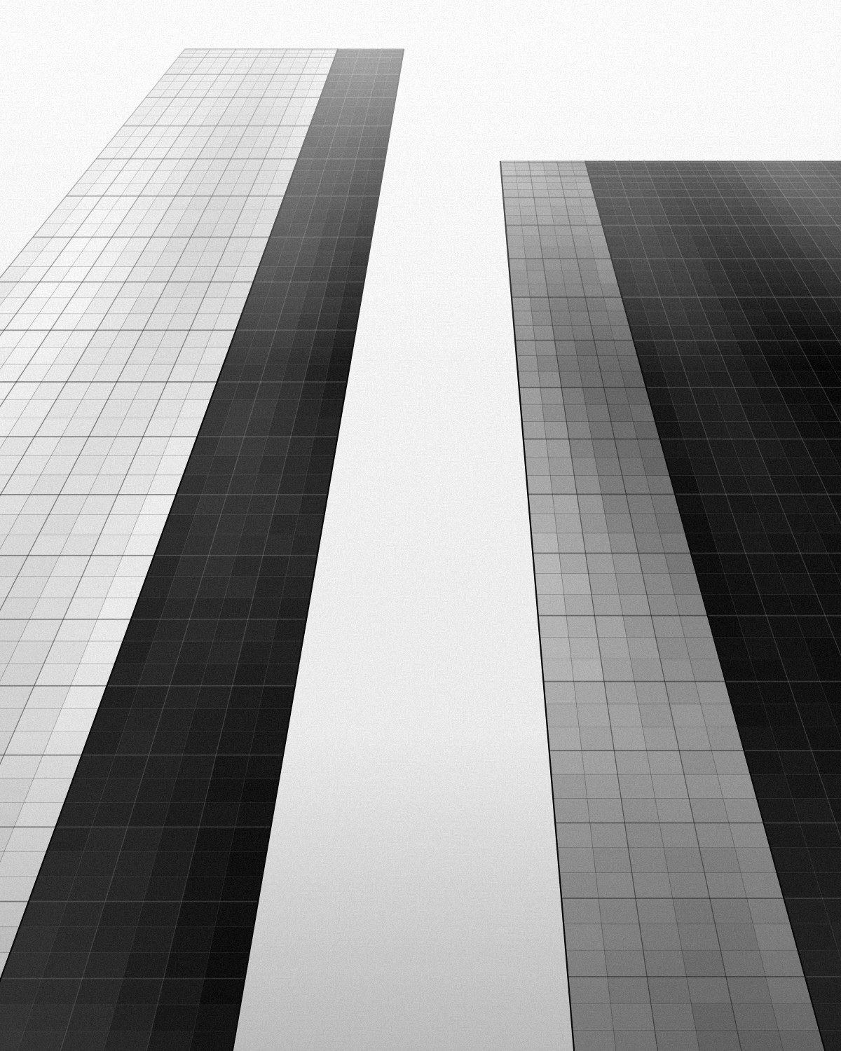 Black and white view looking up at two office towers